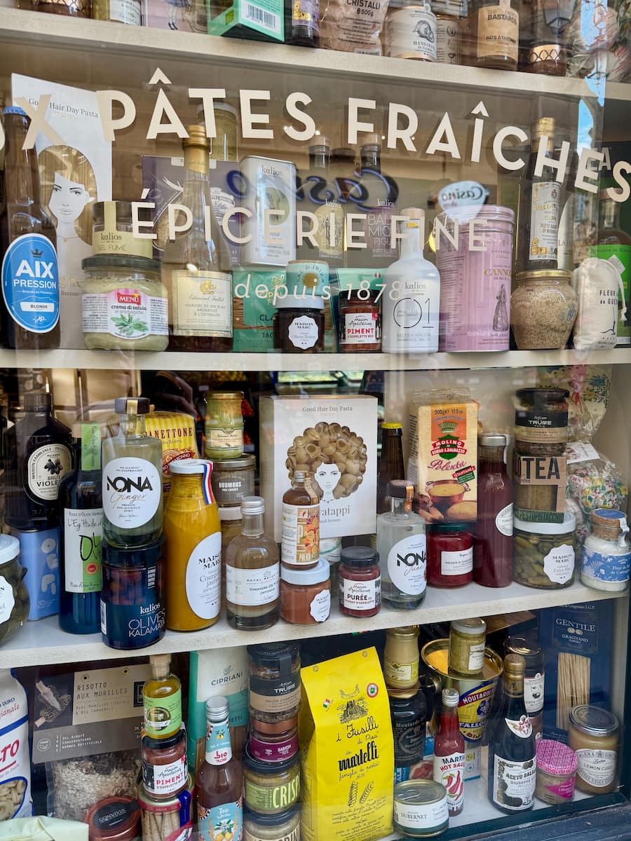 shop window of an Italian fresh pasta shop with condiments and beer from Aix-en-Provence in the window