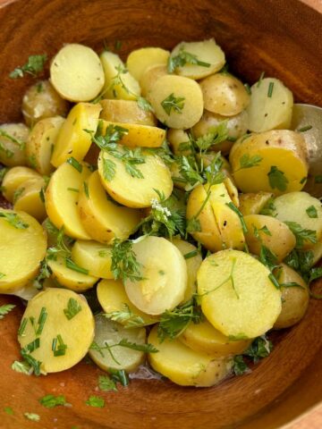 sliced potatoes tossed in white wine, vinaigrette and fresh chopped herbs