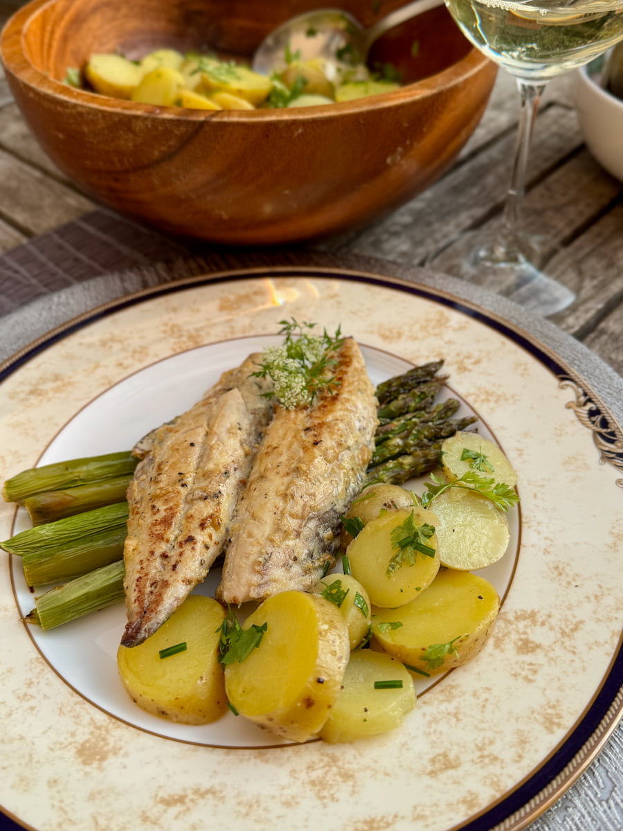 serving a classic French potato salad with roasted asparagus topped with pan-fried mackerel in Dijon mustard