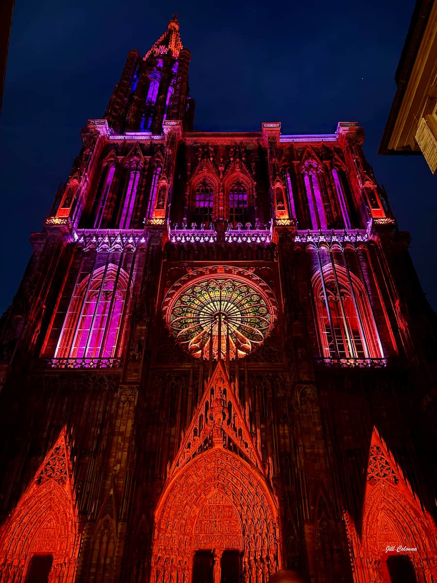 Strasbourg cathedral lit up in dramatic red colours during the summer light show